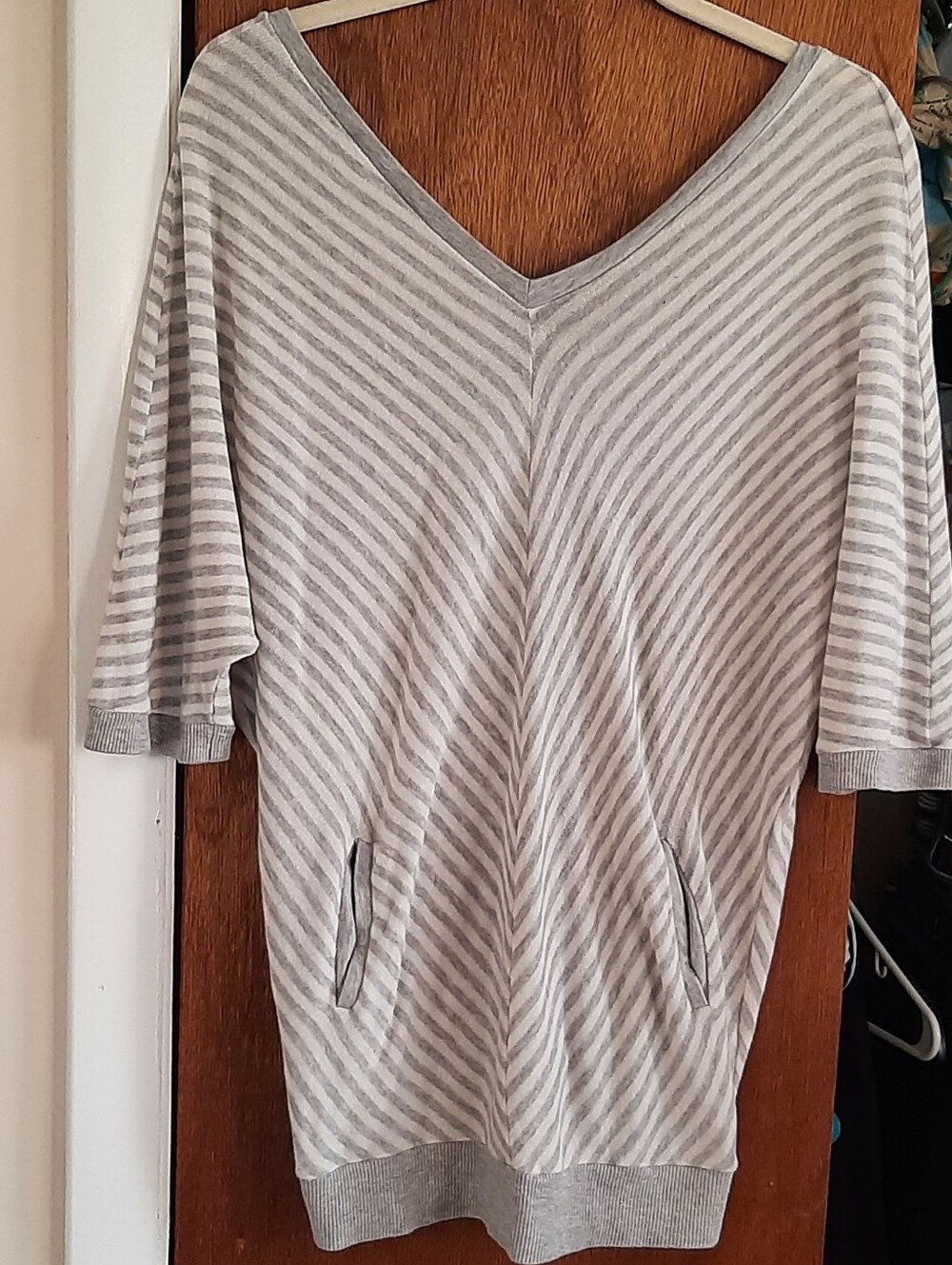 Cute Drapy Top With Buttoned Back & Pockets In Front